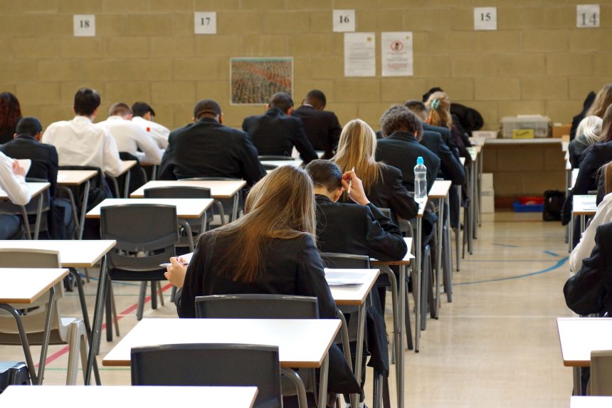 Students sitting their A-levels in an exam hall.