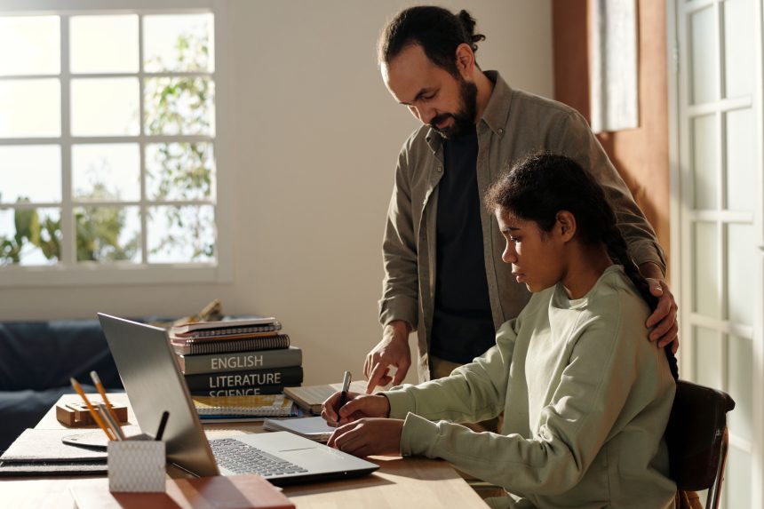 Father helping his daughter prepare for A Level results day.