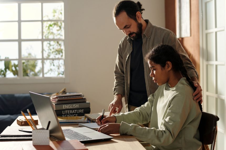 Father helping his daughter prepare for A Level results day.