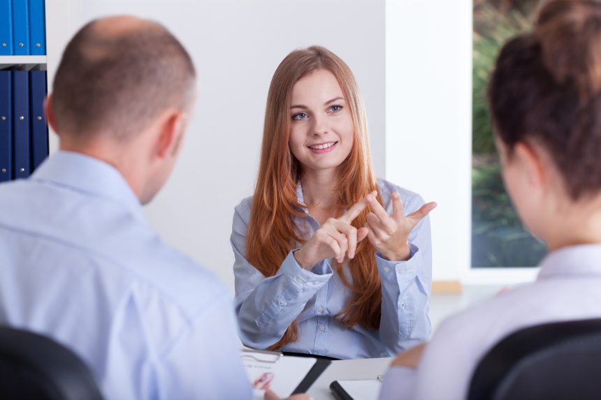 A female chatting to her university interviewers.