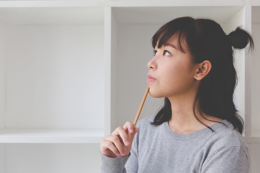 Female student thinking about her career aspirations.