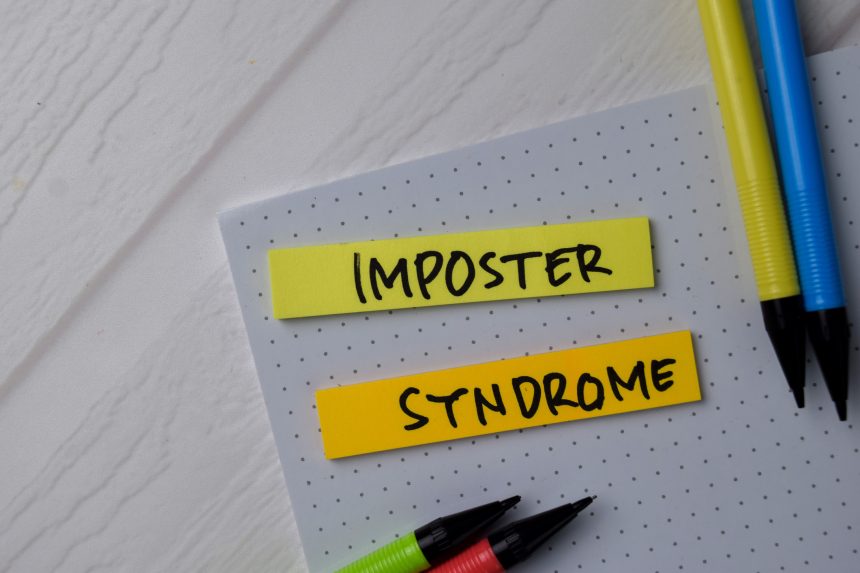 Imposter syndrome text on sticky notes.