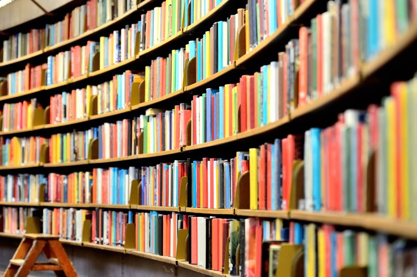 A bookcase in a library.