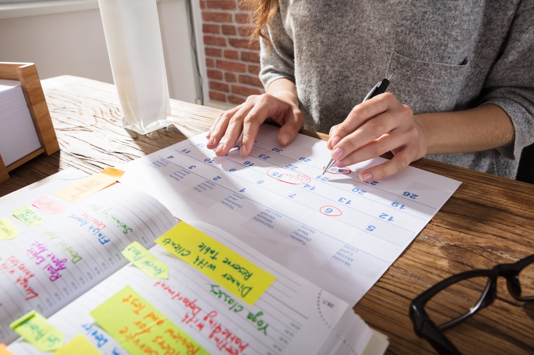 A young girl making a revision timetable.