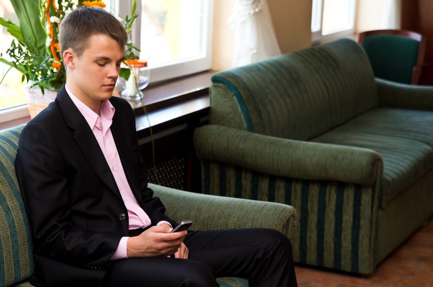 A male student waiting for a university interview.