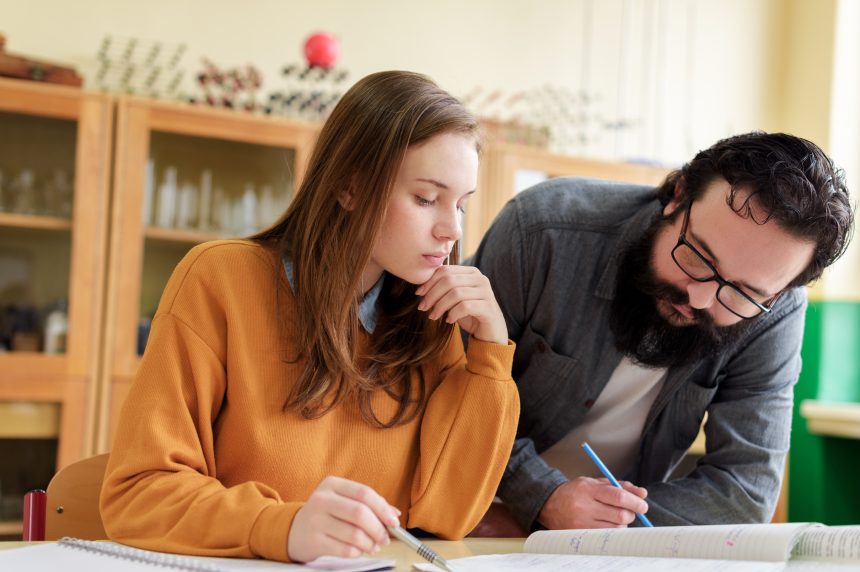 Tuition session with male tutor and female student.