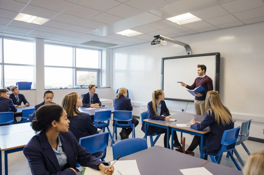 Secondary school teacher addressing his class.