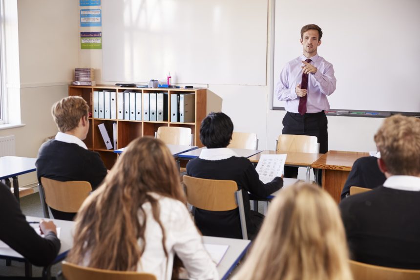 Students listening to their teacher in class.