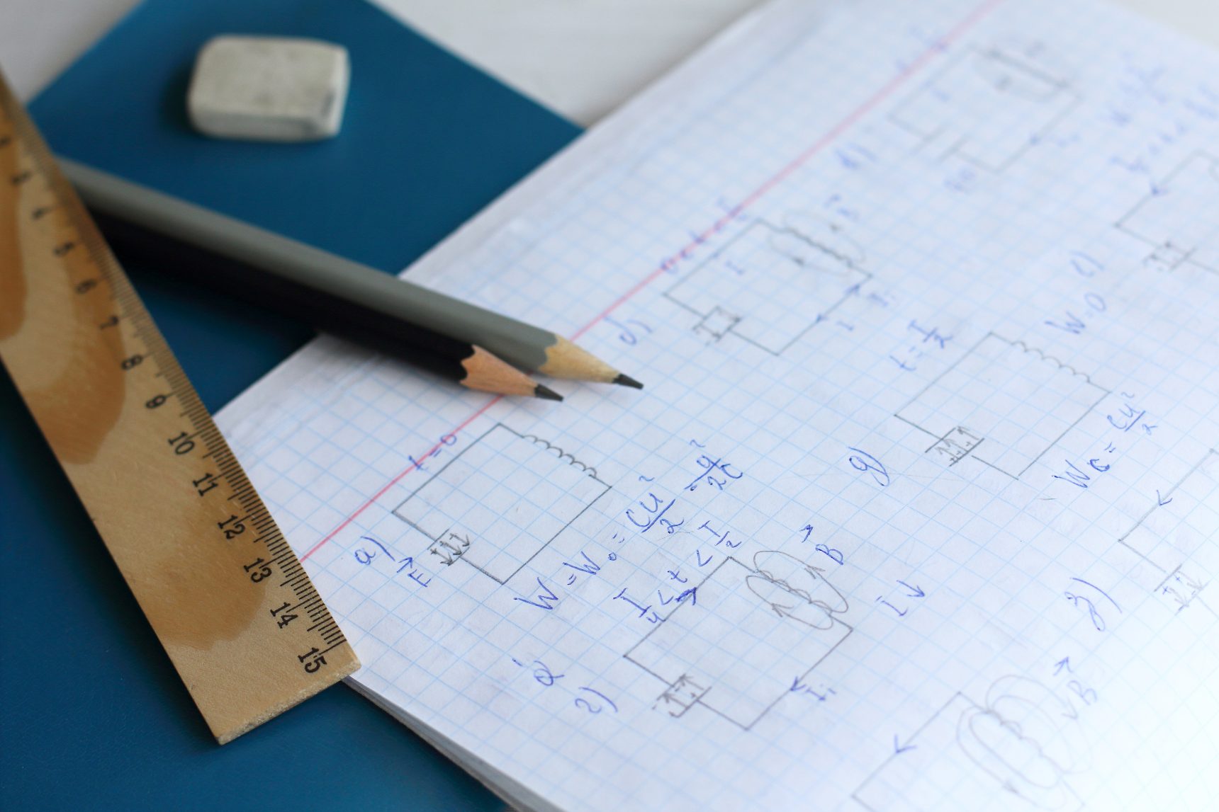 An A Level Physics exercise book displaying electric circuit diagrams.