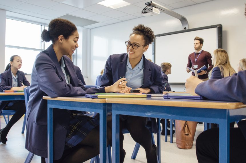 Two female student working in pairs to complete a retrieval task.