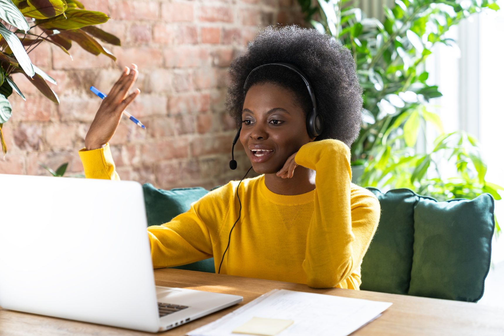 Female self-employed online tutor talking to student.