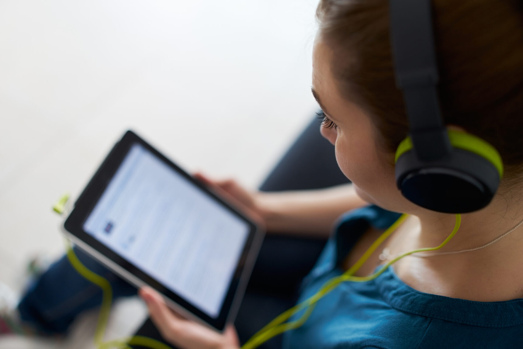 Teacher listening to podcast for teacher CPD.