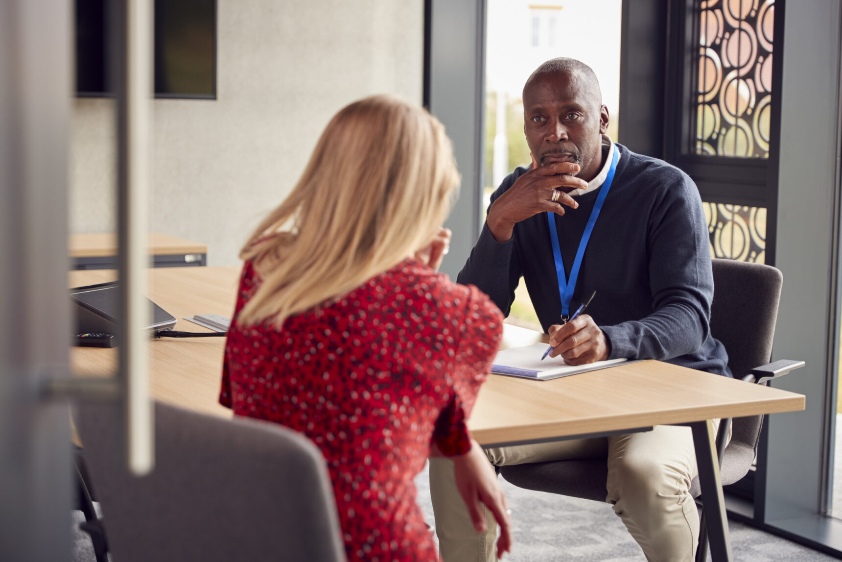 A female student s discussing an A Level Remark with her teacher.