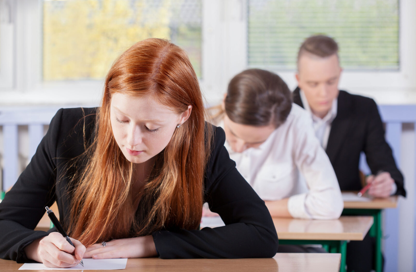 A group of GCSE students are sitting an exam.